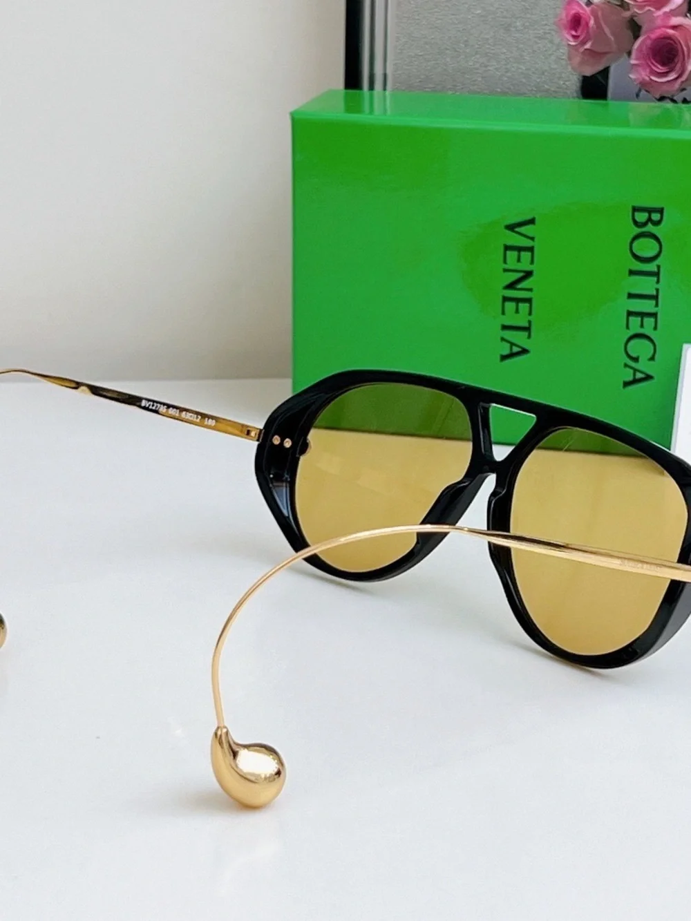 Bottega Veneta Black Frame Sunglasses with Amber Lenses and Gold Details